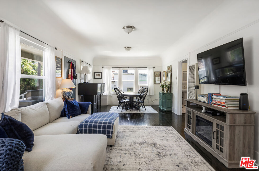 1120 West Edgeware Road Los Angeles, CA 90026 - Photo 8 of 32 a living room with furniture and a flat screen tv