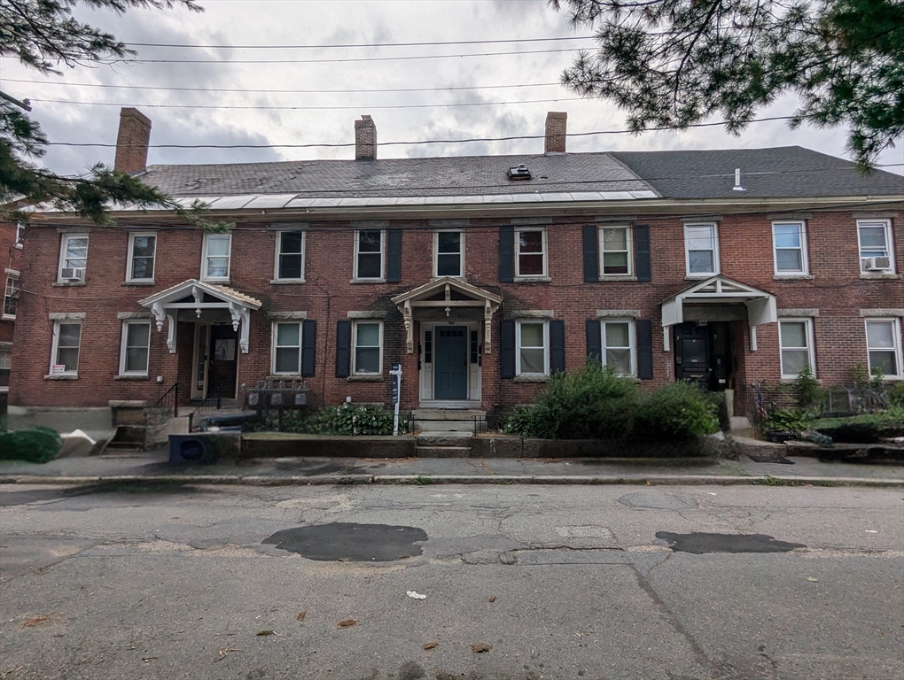 62 Grove Street Fitchburg, MA 01420 - Photo 3 of 4 a front view of residential houses