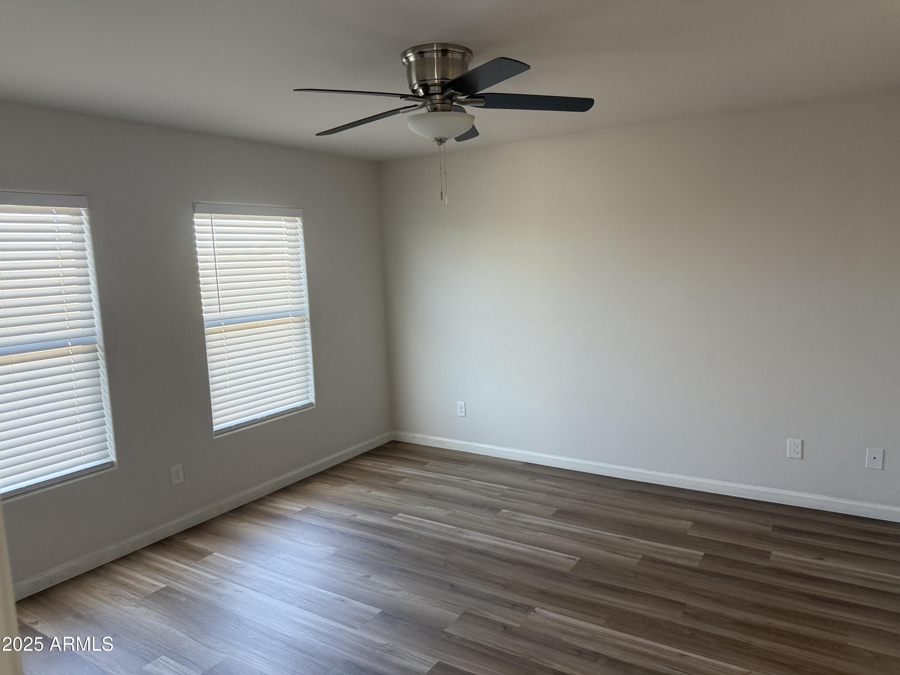 1098 South 11th Street Coolidge, AZ 85128 - Photo 13 of 20 a view of a room with wooden floor and a window