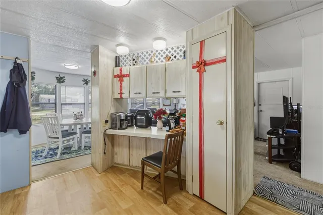 a view of a livingroom with furniture and a window