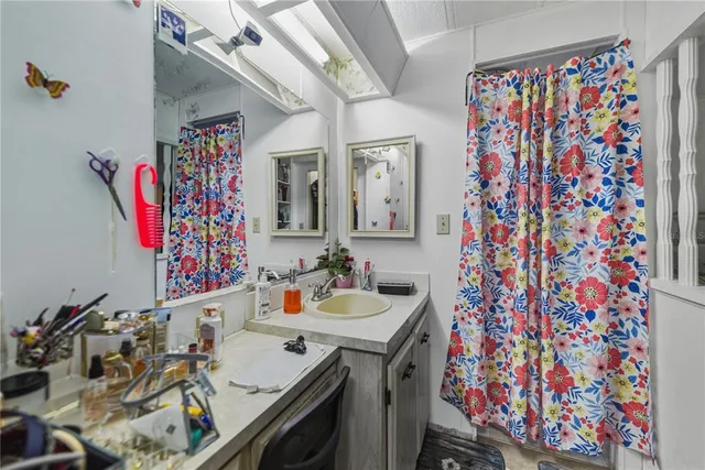 a bathroom with a sink and a mirror