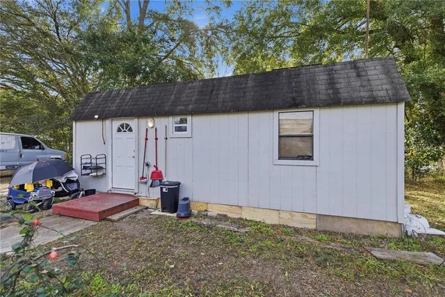 a backyard of a house with seating space
