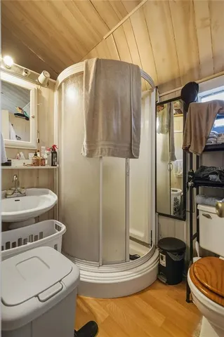 a bathroom with a toilet and a shower