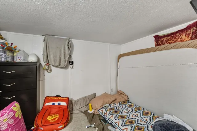 a bedroom with a bed and a closet