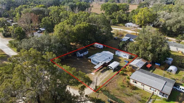 an aerial view of a house with a garden