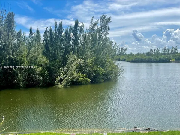 a view of a lake with a city
