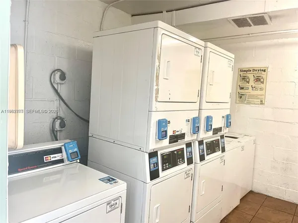 a view of a kitchen with a window and washer