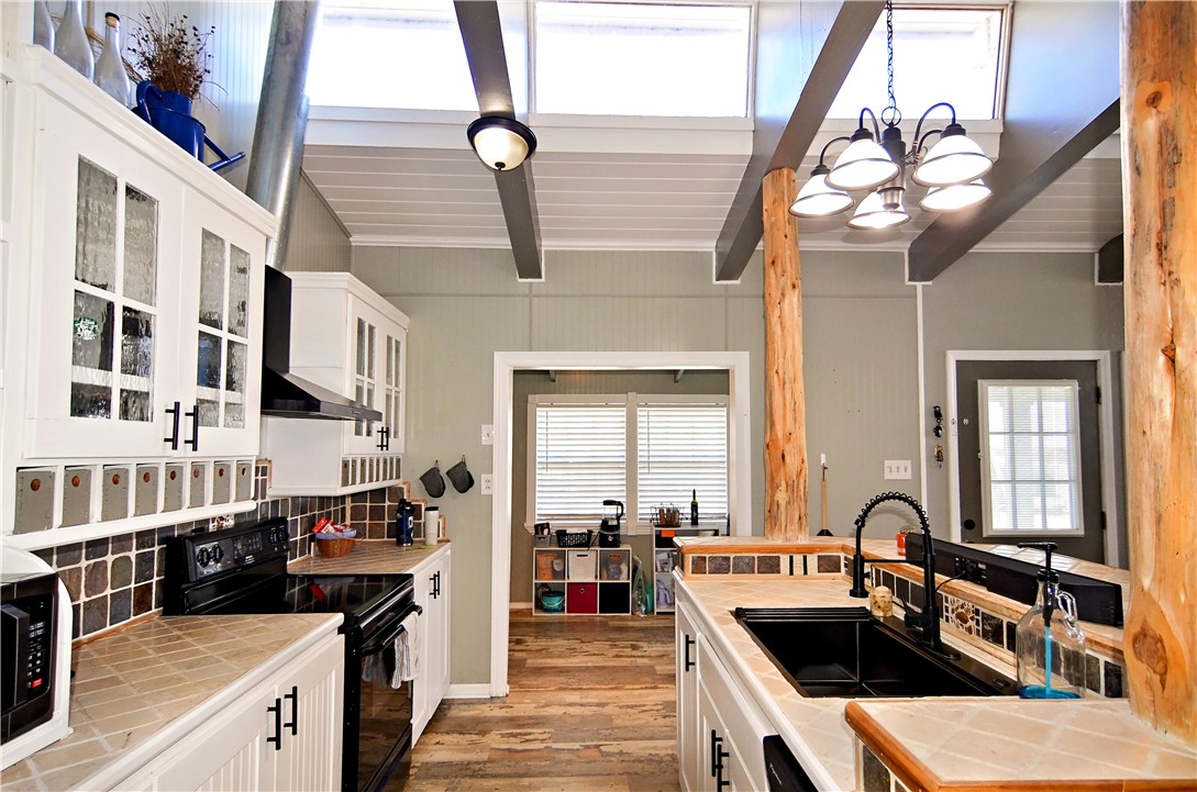 147 Trail Ridge Drive Sandia, TX 78383 - Photo 11 of 31 a kitchen with a sink appliances and cabinets