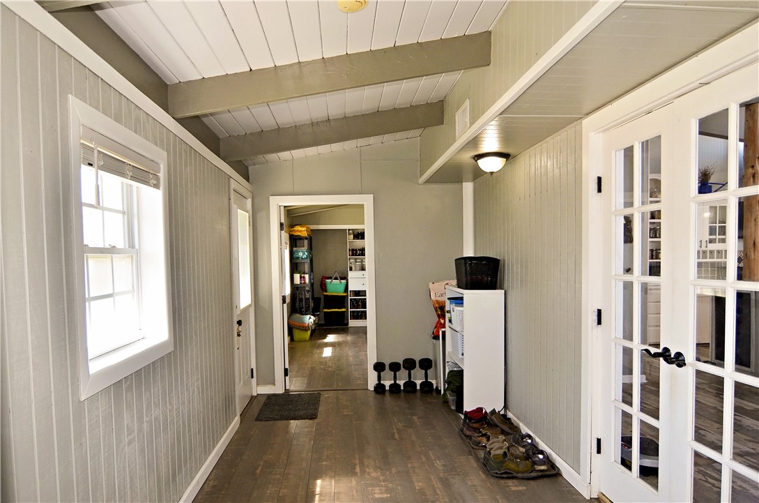 147 Trail Ridge Drive Sandia, TX 78383 - Photo 16 of 31 a view of a hallway with bathroom and wooden floor