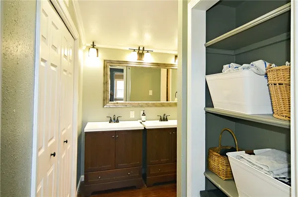 a en suite bathroom with a sink and mirror