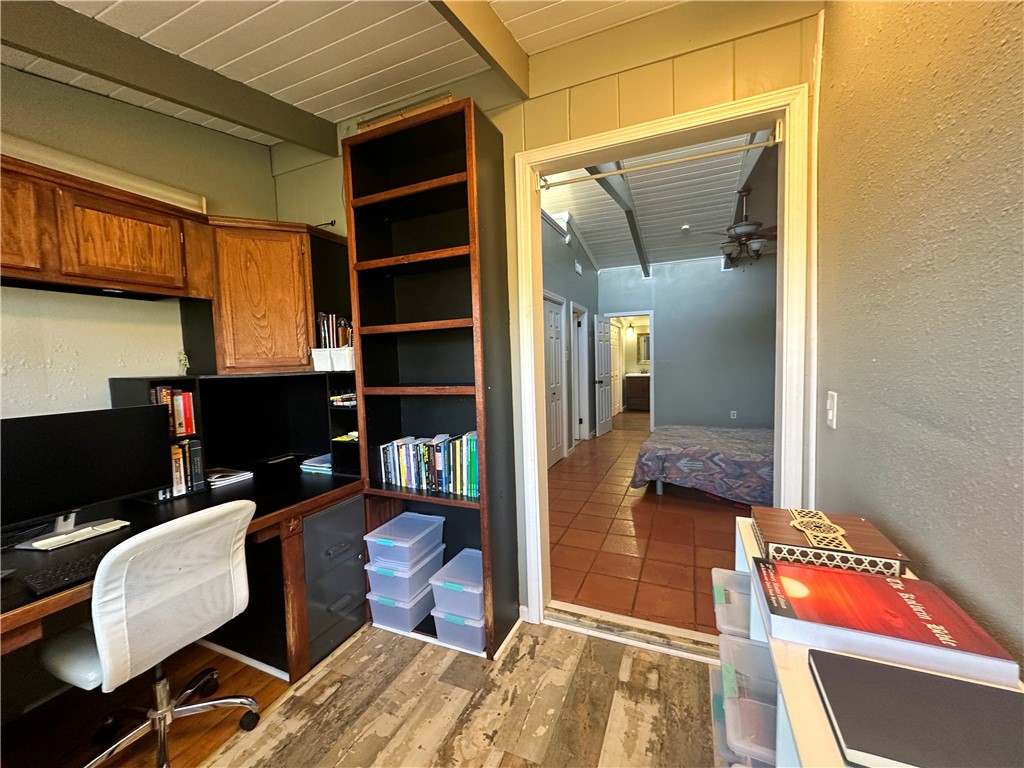 147 Trail Ridge Drive Sandia, TX 78383 - Photo 25 of 31 a workspace with furniture and a bookshelf