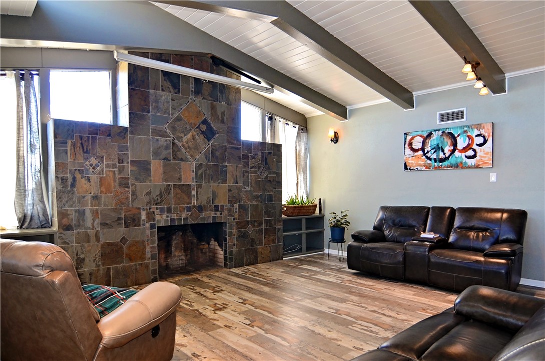 147 Trail Ridge Drive Sandia, TX 78383 - Photo 7 of 31 a living room with furniture a fireplace and a table