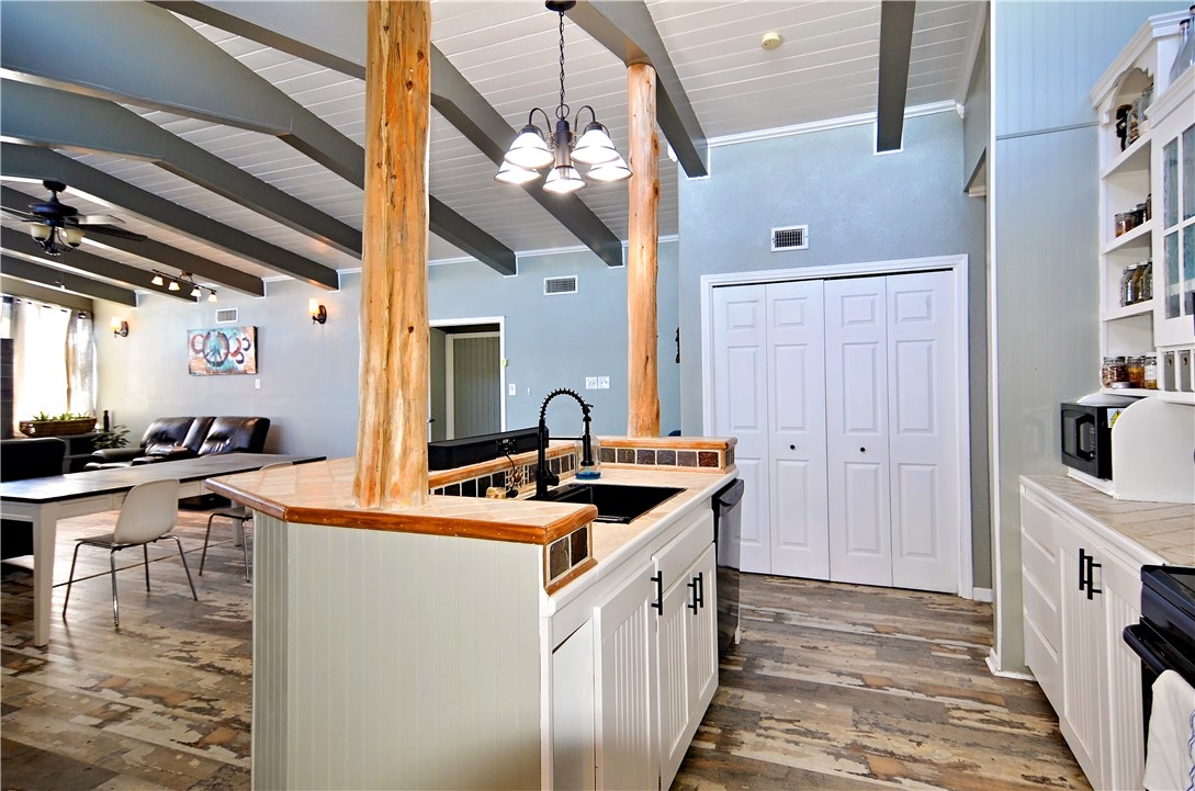 147 Trail Ridge Drive Sandia, TX 78383 - Photo 10 of 31 a kitchen that has a lot of white cabinets and stainless steel appliances