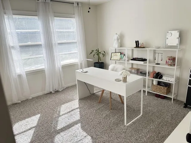 a view of a workspace with furniture