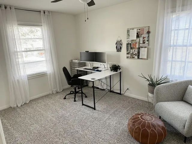 a workspace with furniture and window
