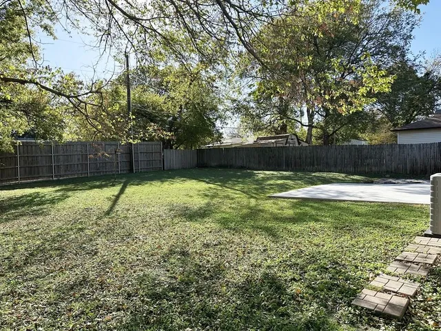 a swimming pool with wooden fence
