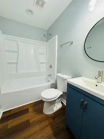 a bathroom with a toilet a sink and bathtub