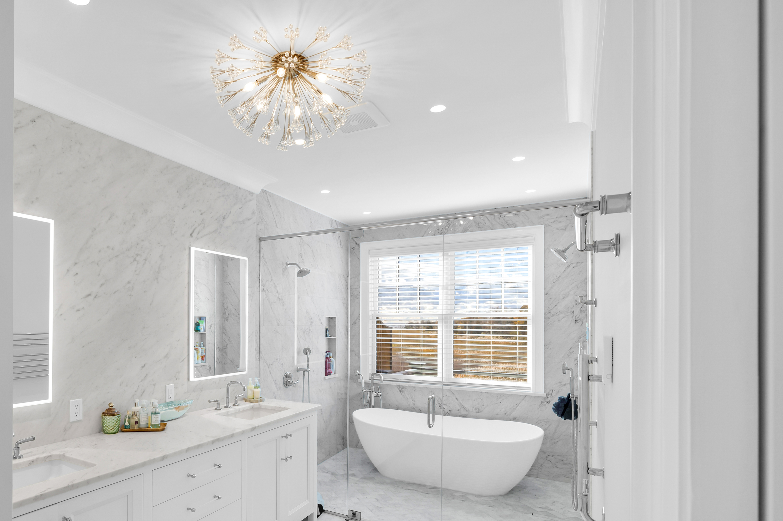 405 Whitfield Street, Unit 2 Guilford, CT 06437 - Photo 16 of 40 a spacious bathroom with a double vanity sink tub and a mirror