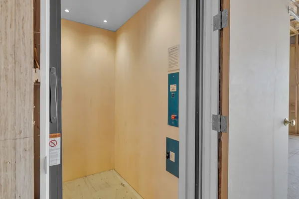 a view of an empty room with a balcony