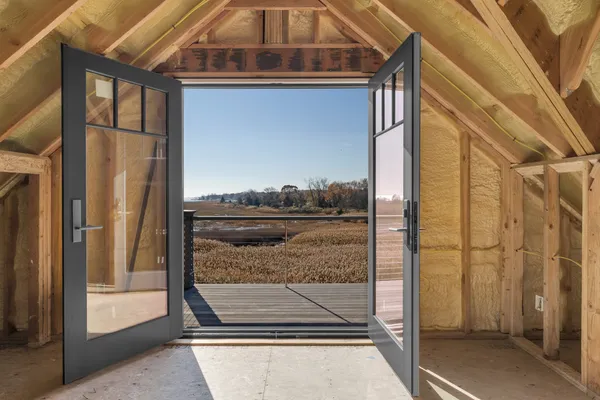 a view of living room that has a large window