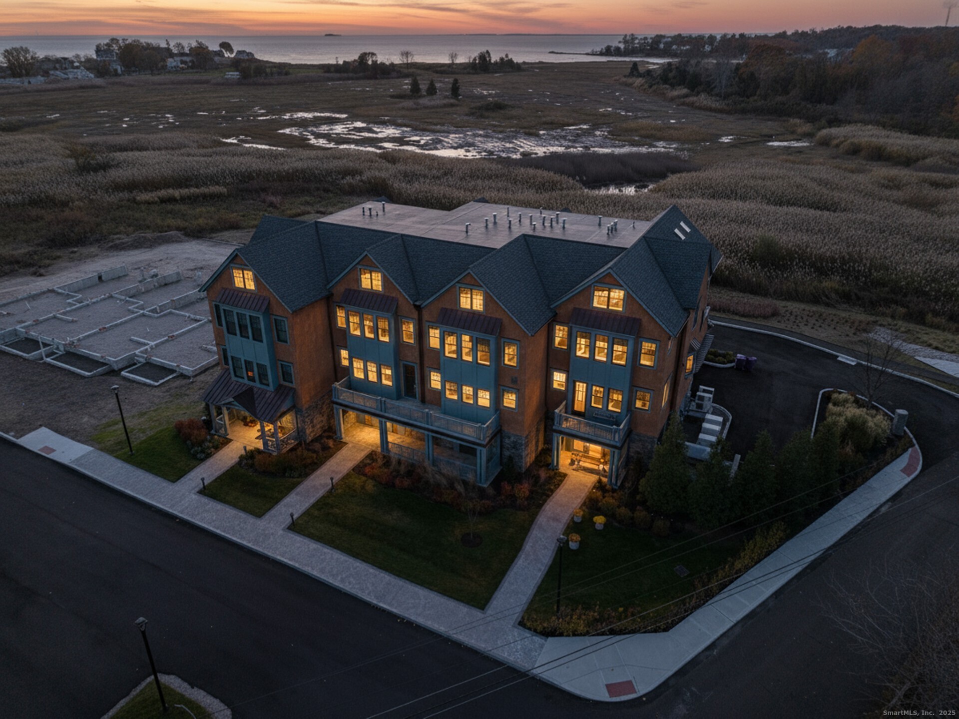 405 Whitfield Street, Unit 2 Guilford, CT 06437 - Photo 6 of 40 Aerial photo showing the condo building with L.I.S. in the background. Exterior features cedar shingles, 50-year Timberline Asphalt roof and copper gutters.