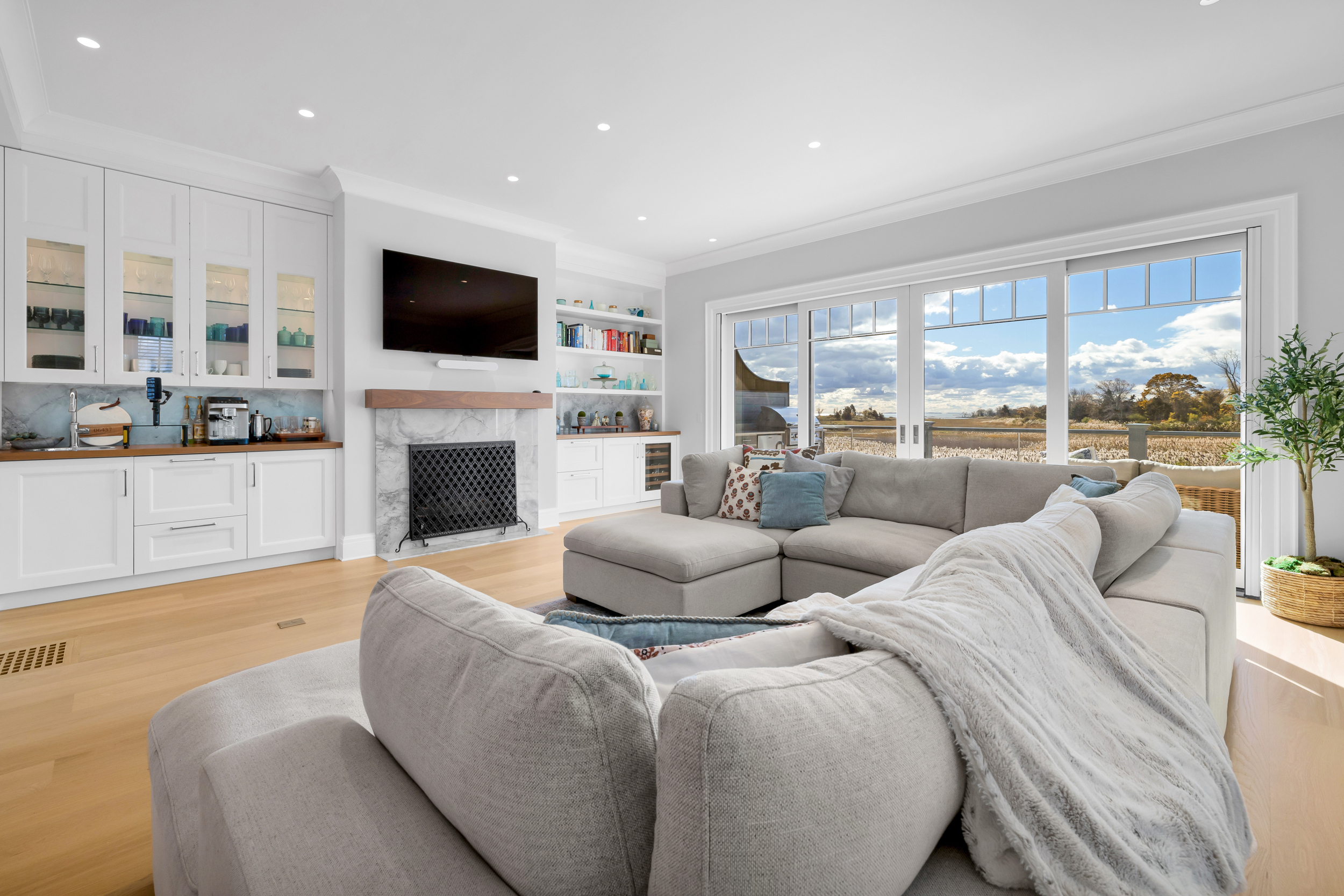 405 Whitfield Street, Unit 2 Guilford, CT 06437 - Photo 36 of 40 a living room with fireplace furniture and a flat screen tv