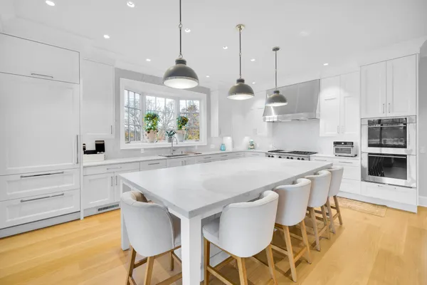 a view of a balcony with an outdoor seating