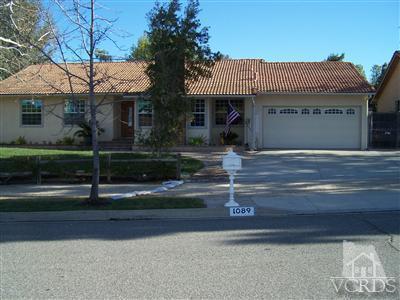 1089 Rambling Road Simi Valley, CA 93065 - Photo 1 of 25 a front view of a house with a yard