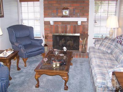 1089 Rambling Road Simi Valley, CA 93065 - Photo 10 of 25 a living room with furniture and a fireplace