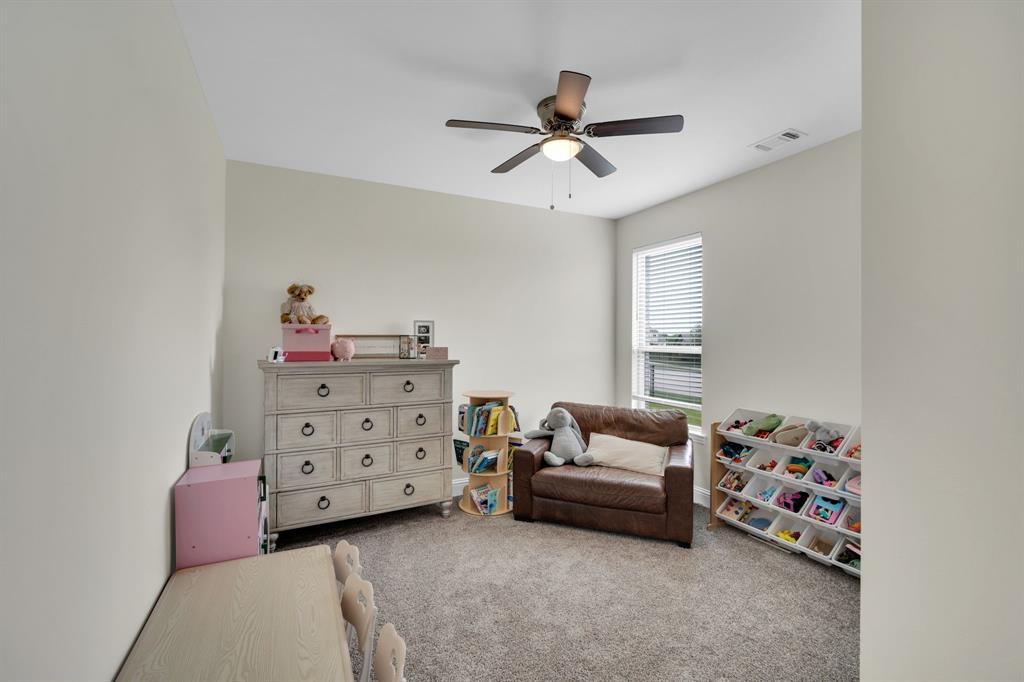 1601 Bear Path Way Gunter, TX 75058 - Photo 27 of 40 a bedroom with furniture and a window