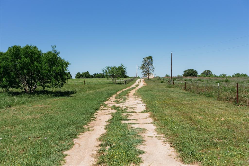 a view of a road with a yard