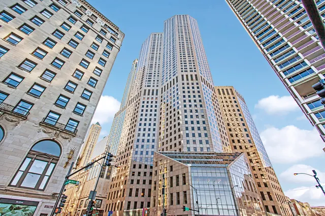 a view of living room with furniture and floor to ceiling windows