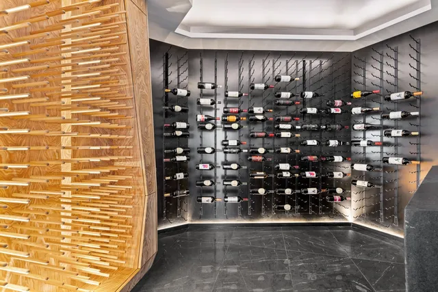 a bedroom with bed and a large window