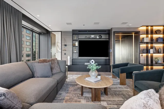 a bathroom with a shower and a glass door