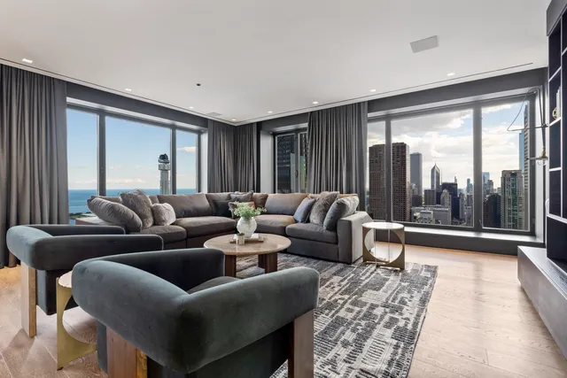 a bathroom with a bathtub a double vanity sink and mirror