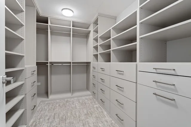 a kitchen with stove and cabinets