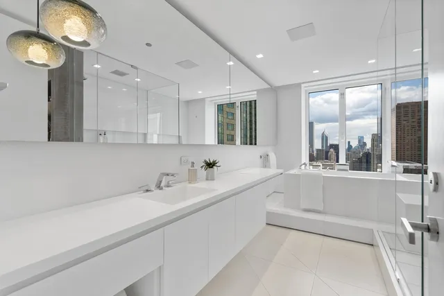 a kitchen with stainless steel appliances granite countertop a stove and a refrigerator