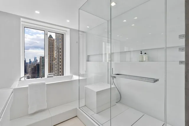 a view of a bathroom with a sink and mirror