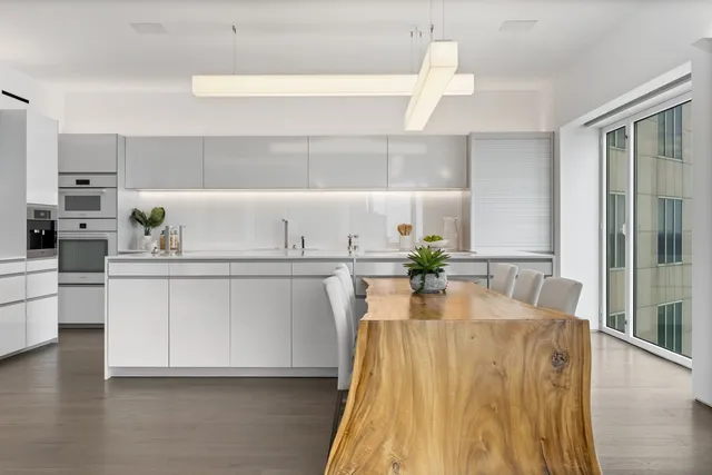 a kitchen with a cabinets and window