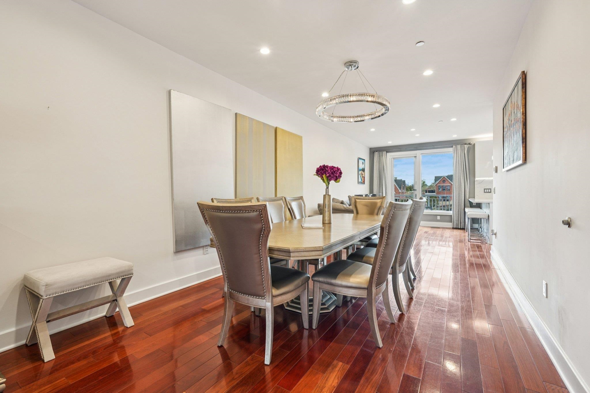 25 Vela Way, Unit 25 Edgewater, NJ 07020 - Photo 13 of 42 a view of a dining room with furniture and wooden floor