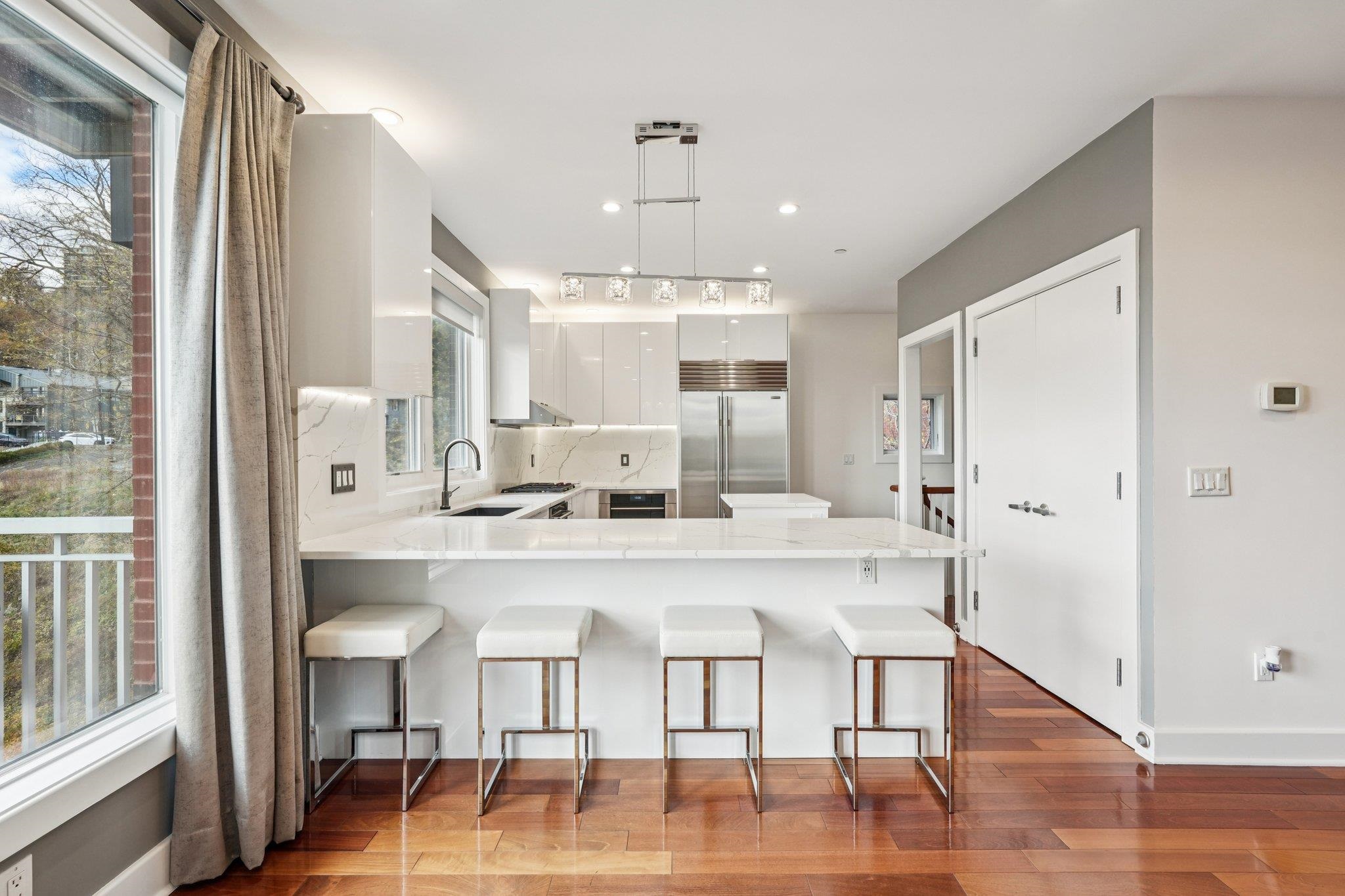 25 Vela Way, Unit 25 Edgewater, NJ 07020 - Photo 17 of 42 a view of a kitchen and dining room