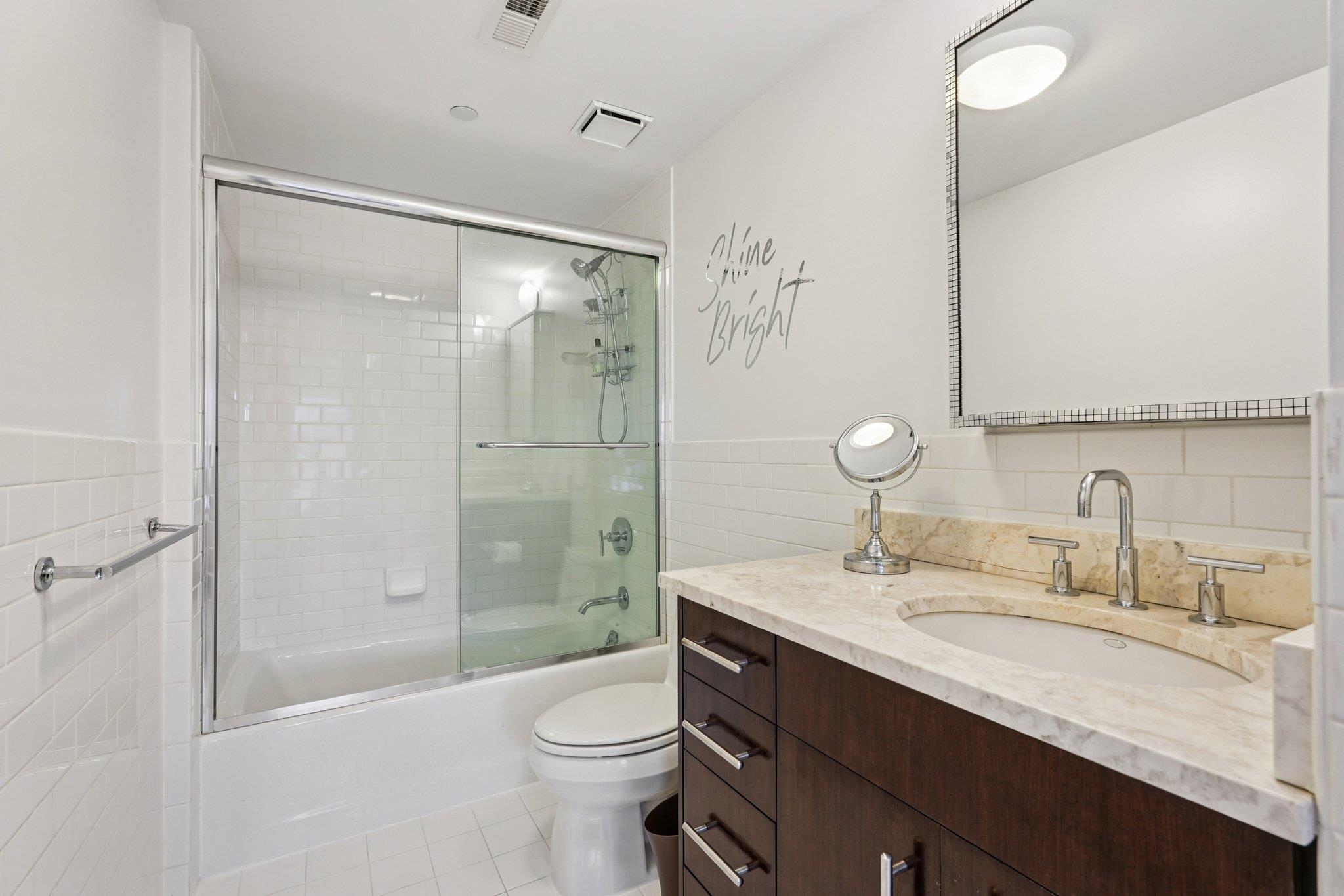 25 Vela Way, Unit 25 Edgewater, NJ 07020 - Photo 2 of 42 a bathroom with a sink a toilet and shower