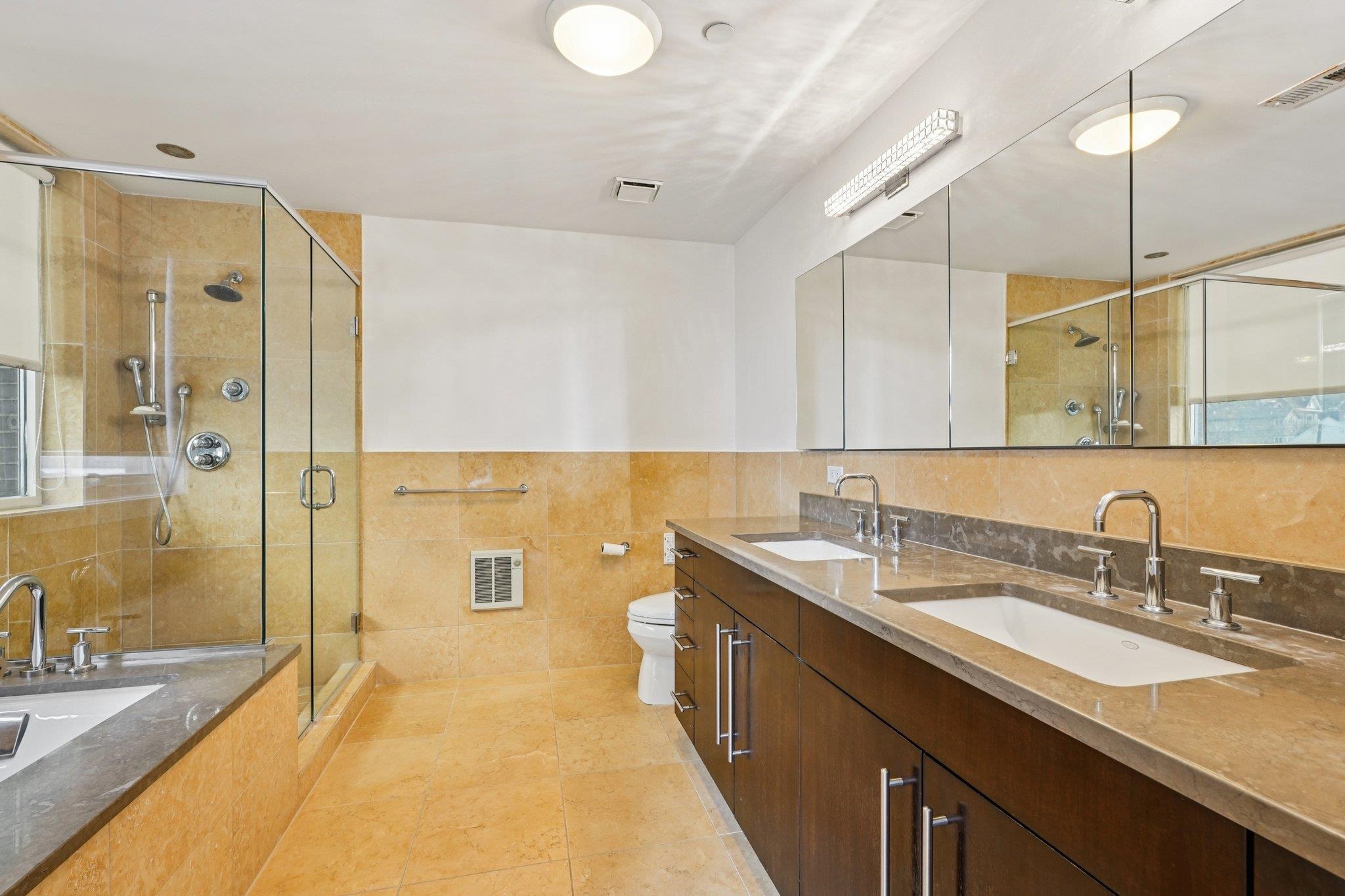 25 Vela Way, Unit 25 Edgewater, NJ 07020 - Photo 26 of 42 a spacious bathroom with a double vanity sink mirror double and shower