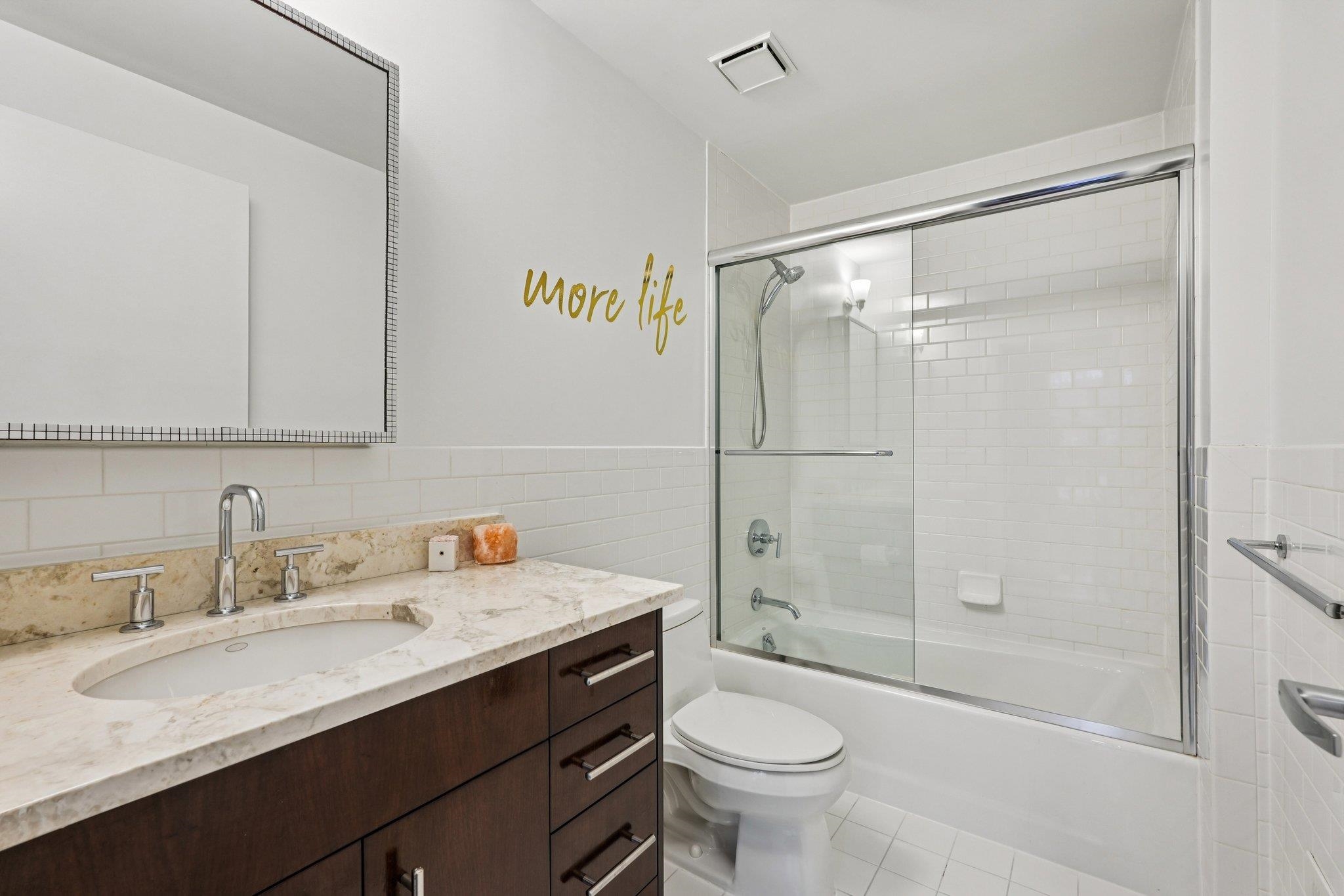 25 Vela Way, Unit 25 Edgewater, NJ 07020 - Photo 33 of 42 a bathroom with a sink toilet and shower