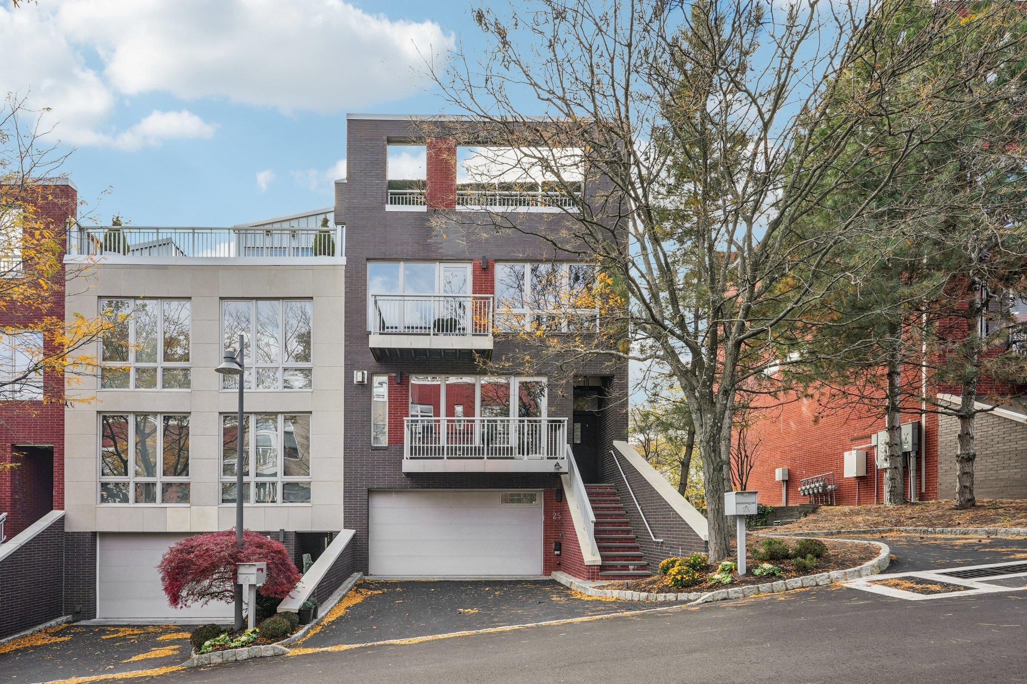 25 Vela Way, Unit 25 Edgewater, NJ 07020 - Photo 40 of 42 a view of a building with a street