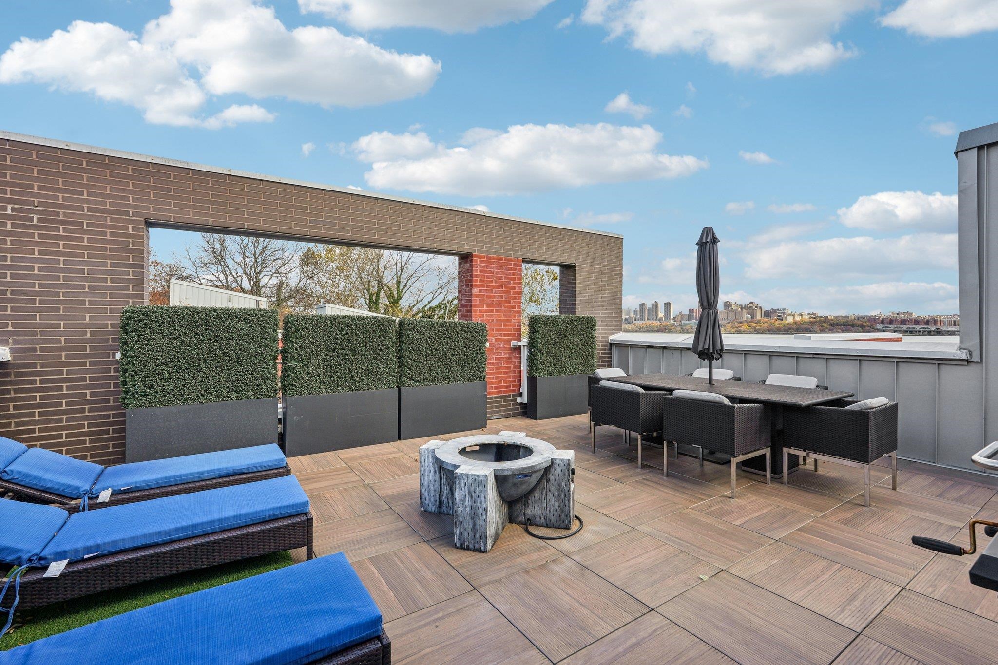 25 Vela Way, Unit 25 Edgewater, NJ 07020 - Photo 5 of 42 a building outdoor space with patio furniture