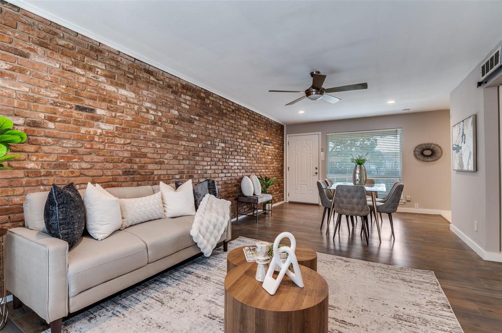 4340 Cedar Springs Road, Unit 205 Dallas, TX 75219 - Photo 2 of 12 a living room with furniture and a fireplace