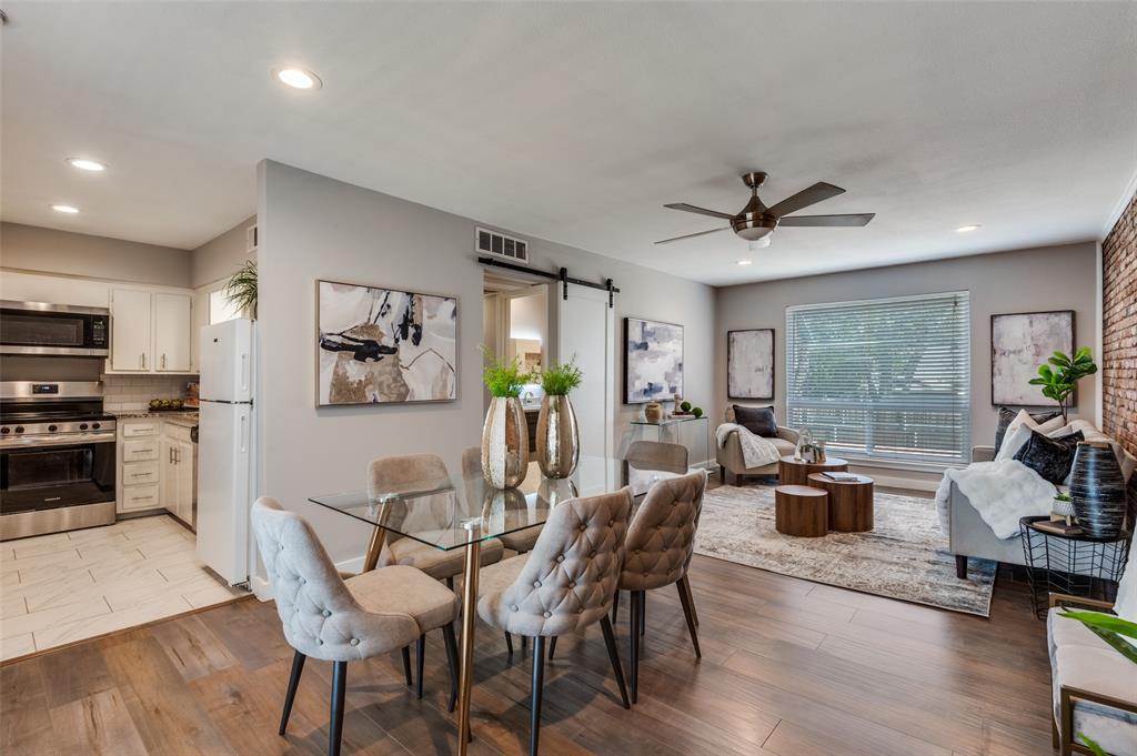 4340 Cedar Springs Road, Unit 205 Dallas, TX 75219 - Photo 3 of 12 a view of a dining room with furniture window and wooden floor