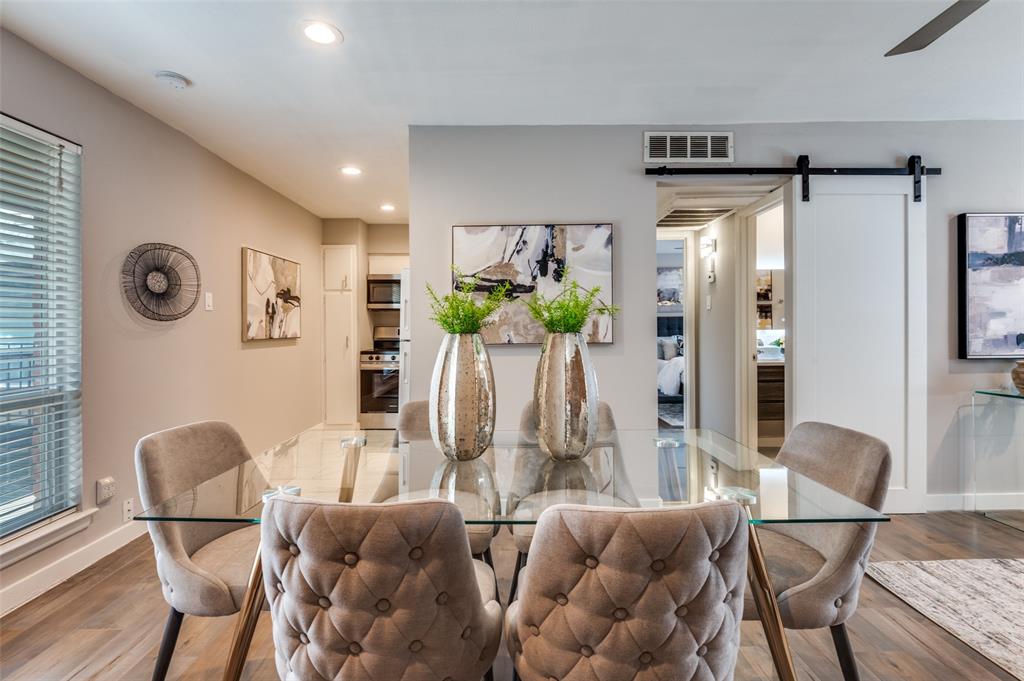 4340 Cedar Springs Road, Unit 205 Dallas, TX 75219 - Photo 6 of 12 a living room with furniture and a chandelier
