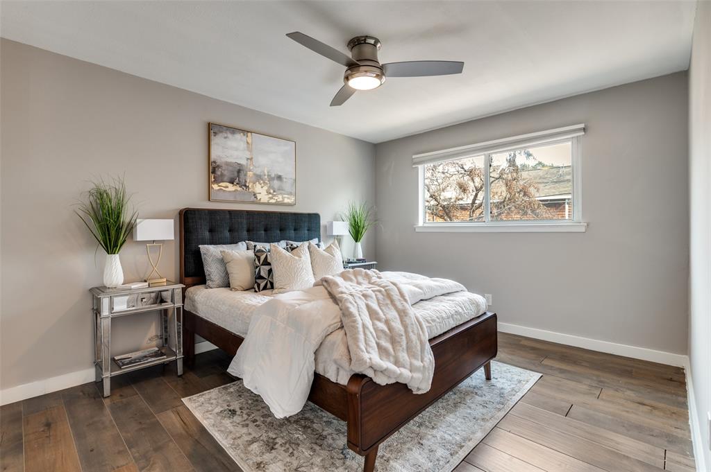 4340 Cedar Springs Road, Unit 205 Dallas, TX 75219 - Photo 7 of 12 a bed room with a bed and a chandelier